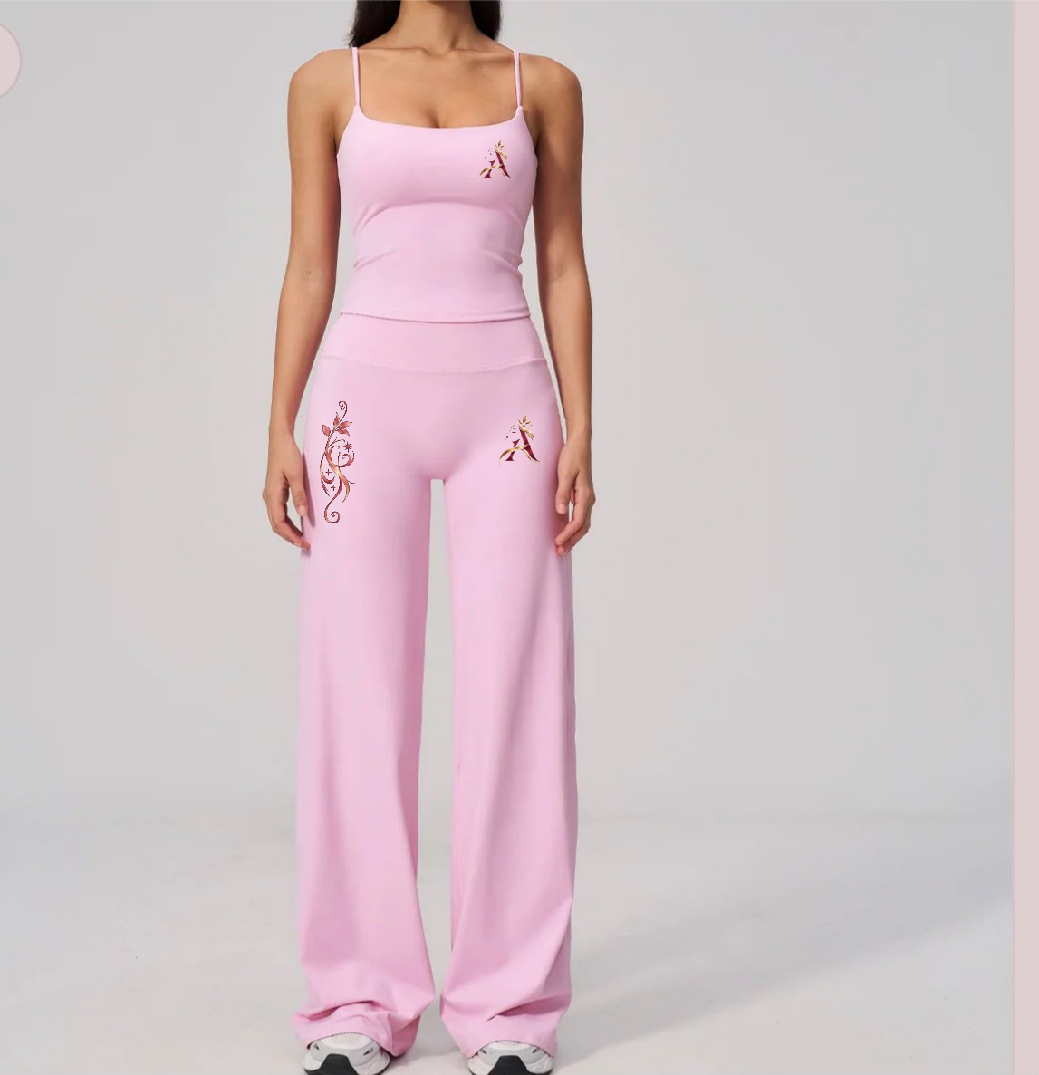 Light pink fitted tank and wide-leg pants matching activewear set with Angelauraluxe logo